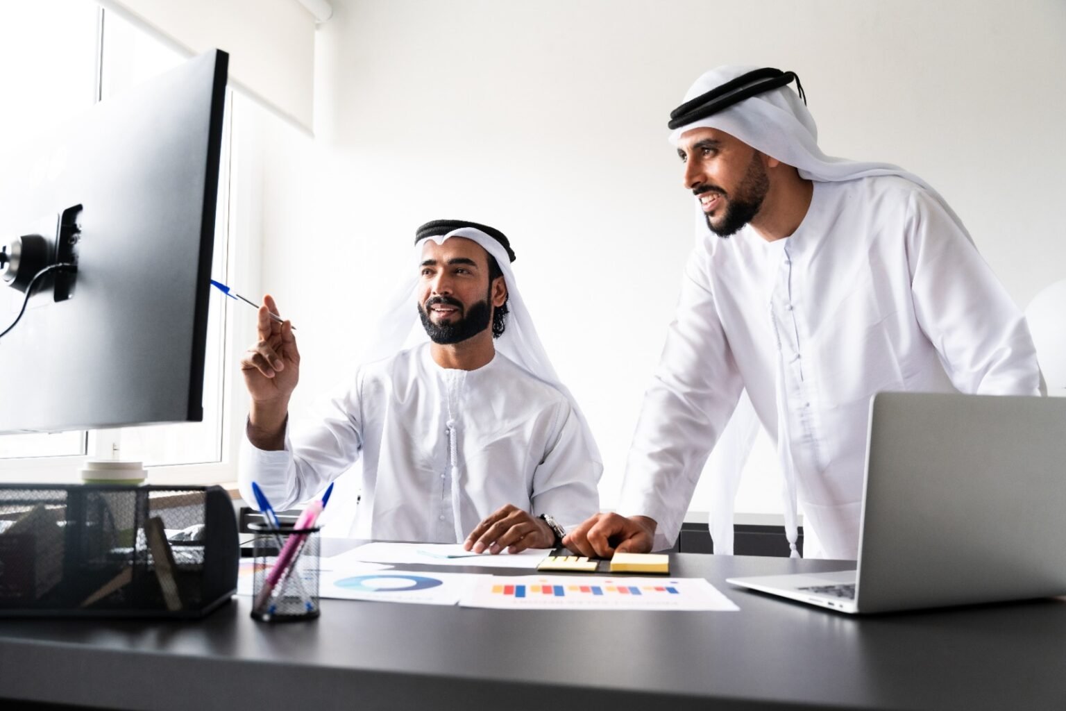 AlMazen team reviewing data on computer
