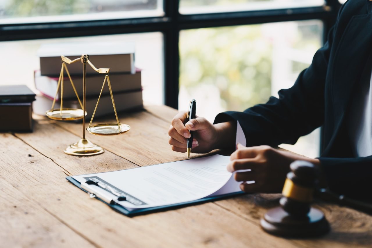 Legal document signing with scales of justice